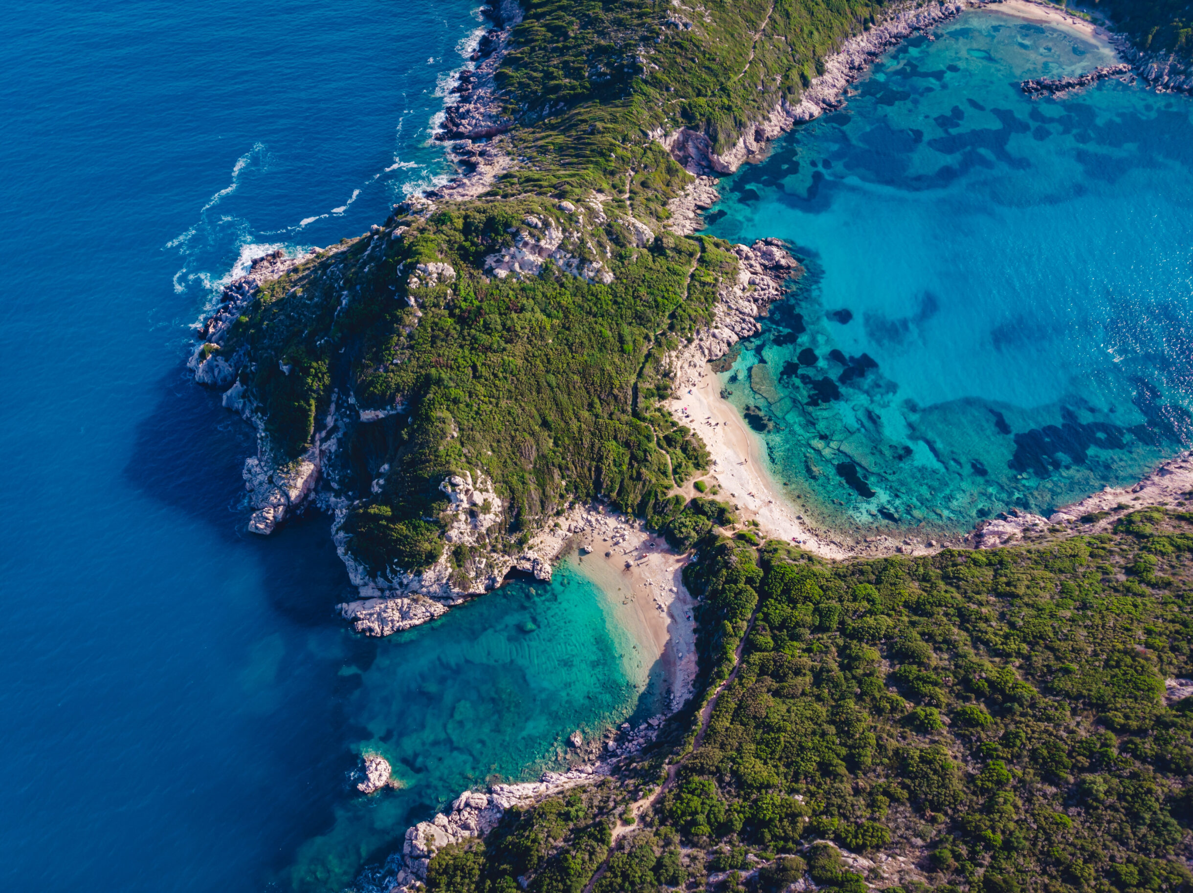 drone shot breathtaking shore porto timoni with deep tropical blue clear turquoise sea at Ζάκυνθος